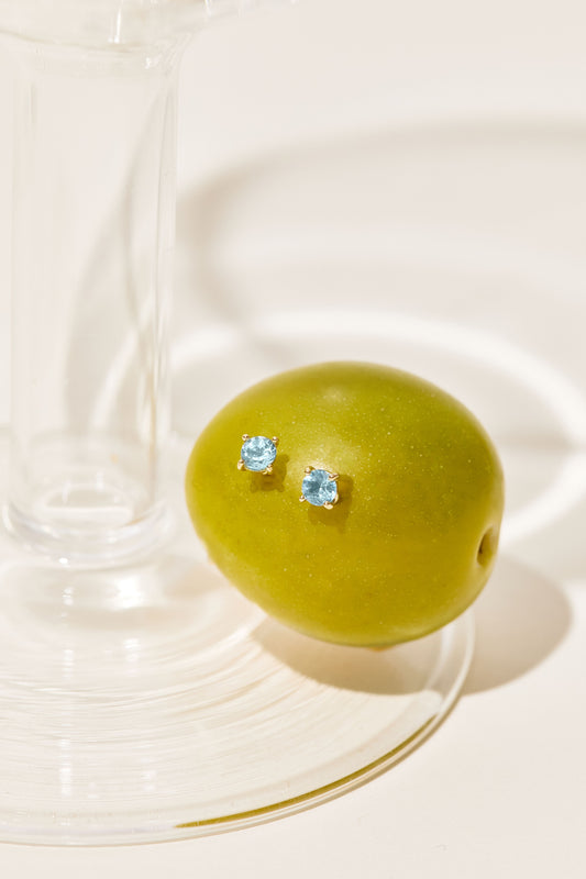 Ohrstecker mit hellblauen Topasen aus 18 K Gold